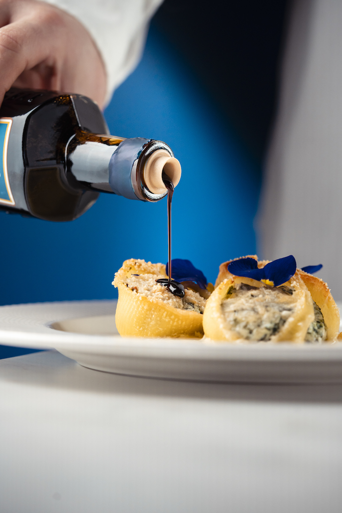 Conchiglioni ricotta e spinaci con fonduta e Aceto Balsamico